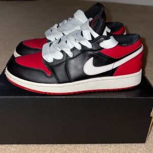 Jordan 1 lows in red and black colorway